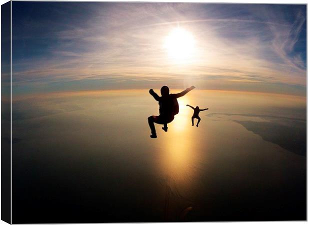 skydive sunset over the bay Canvas Print by Ewan Cowie
