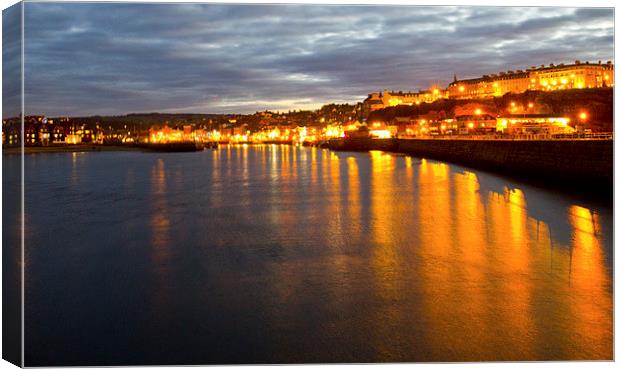 Whitby by night Canvas Print by Colin Brittain
