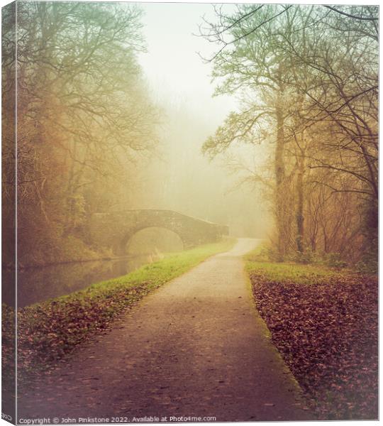 Misty morning by the Canal Canvas Print by John Pinkstone