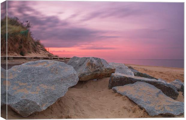  Sunset by the Rocks at Hemsby Beach Canvas Print by James Taylor