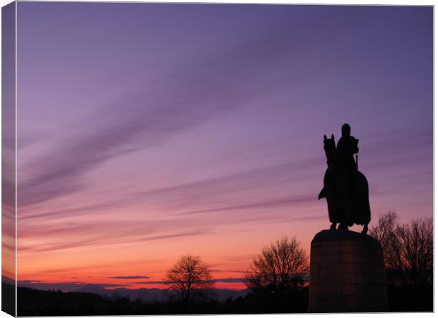 Robert the Bruce statue at sunset. Canvas Print by Tommy Dickson