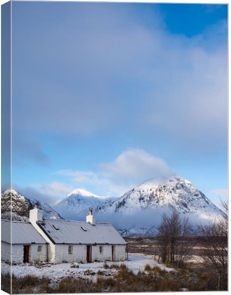 Black Rock Cottage and Buachaille Etive Mor. Canvas Print by Tommy Dickson
