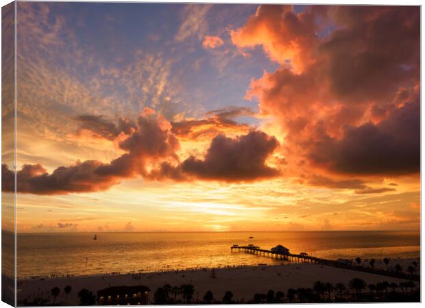 Fiery hues over Pier 60, Clearwater.  Canvas Print by Tommy Dickson