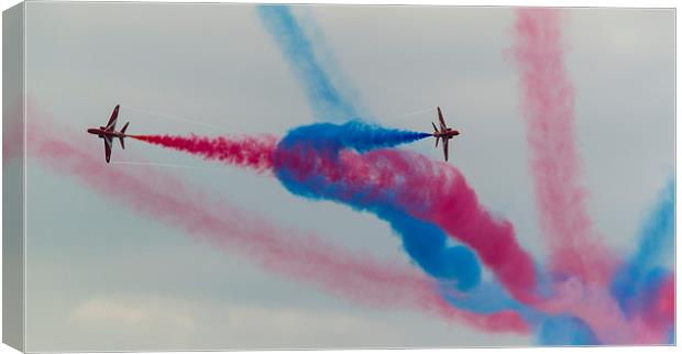 Two Red arrows crossing with smoke on Canvas Print by Kenneth Dear