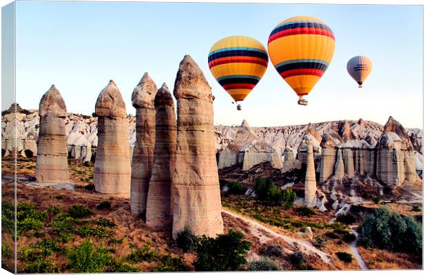 Balloons, Fairy Chimneys, Cappadocia, Turkey Canvas Print by Geoffrey Higges