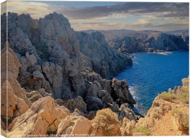 Jagged Cliffs at Fornells Shoreline Menorca Canvas Print by Deanne Flouton