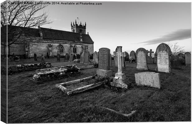  Church and gravestones Canvas Print by Alan Tunnicliffe