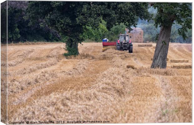 Baling straw Canvas Print by Alan Tunnicliffe