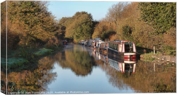 Early morning on the canal Canvas Print by Alan Tunnicliffe