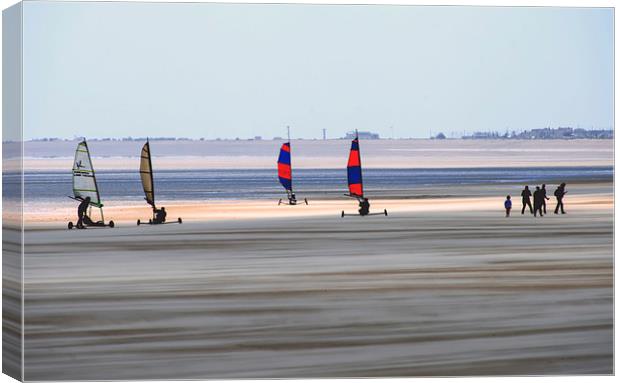 Wind Sand surfers on a stormy day with sand blowin Canvas Print by Susan Sanger