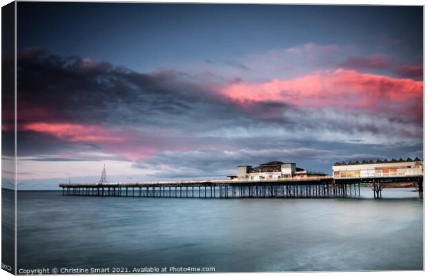 Sunset over Colwyn Bay Pier, North Wales Canvas Print by Christine Smart