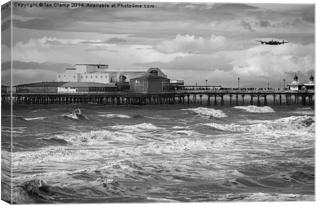 Bomber over the pier Canvas Print by Ian Clamp