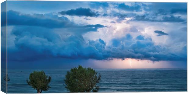 Thunderstorm and lightning over the ocean Canvas Print by Nikos Vlasiadis