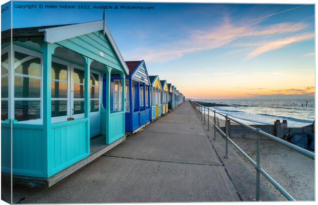A row of colorful beach huts at Southwold Canvas Print by Helen Hotson