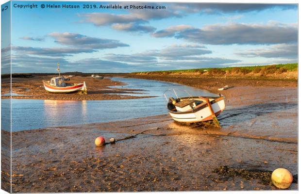 Boats on the river estuary at Burnham Overy Staith Canvas Print by Helen Hotson