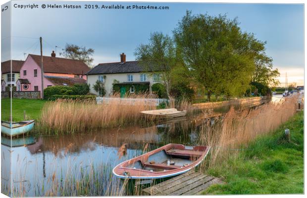 Boats and cottages on the river at West Somerton Canvas Print by Helen Hotson