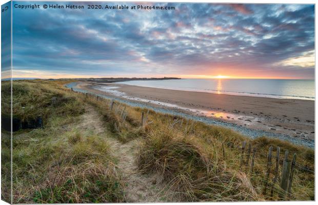 Dramatic sunset over the beach at Llandanwg Canvas Print by Helen Hotson