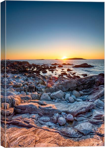 Sunset over the rocky beach at Mealista  Canvas Print by Helen Hotson