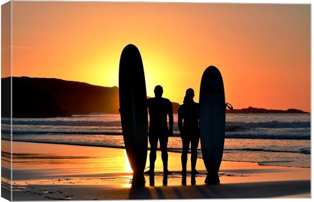 Sunset Surfers Canvas Print by Kelvin Brownsword