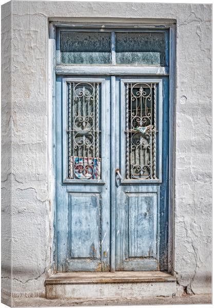 Old Blue Door on Crete Canvas Print by Antony McAulay