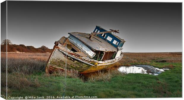 Stranded Boat Canvas Print by Mike Janik