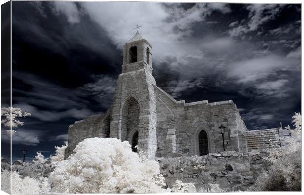 An Infrared shot of the old church on Lindisfarne. Canvas Print by Jim Ripley