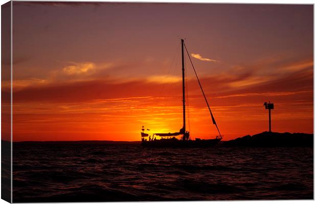 Sunset Sailboat Canvas Print by Ian Pettman