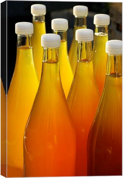 Apple juice in bottles Canvas Print by Matthias Hauser