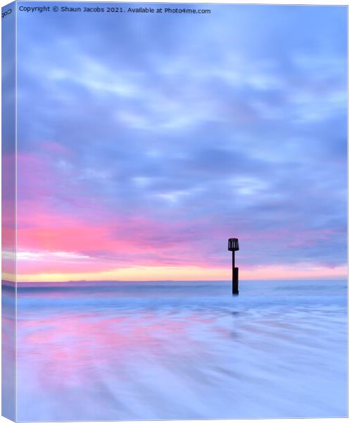 Solitude on Swanage beach  Canvas Print by Shaun Jacobs