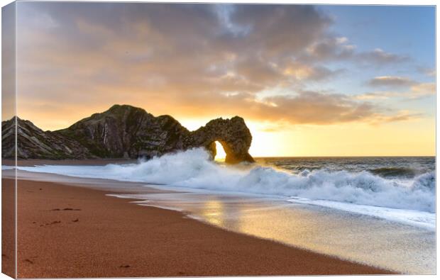 Sunrise through the arch of Durdle Door  Canvas Print by Shaun Jacobs