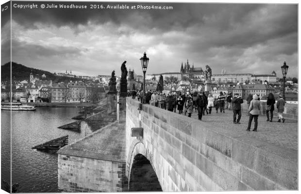 on the Charles Bridge under a stormy sky in Prague Canvas Print by Julie Woodhouse