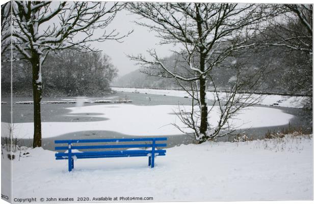 A snow covered blue bench at Bathpool Kidsgrove St Canvas Print by John Keates