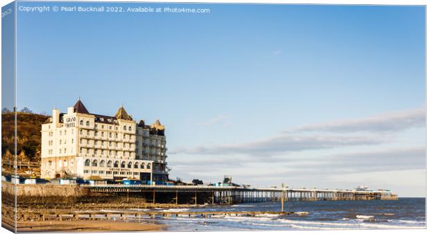 Llandudno Pier and Grand Hotel from North Beach Canvas Print by Pearl Bucknall