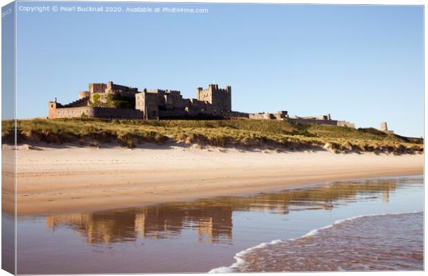 Bamburgh Castle Reflected on Beach Canvas Print by Pearl Bucknall