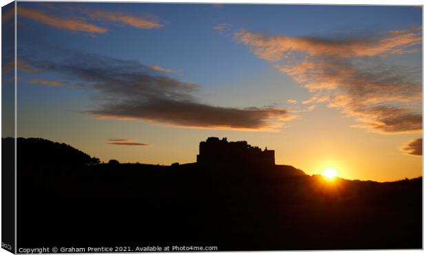 Bamburgh Castle at Sunset Canvas Print by Graham Prentice