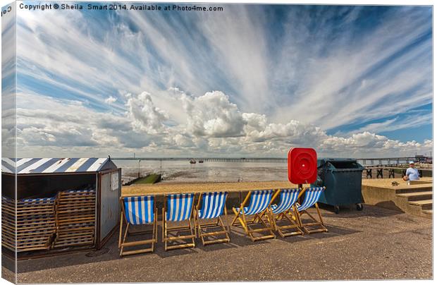 Six empty deckchairs at Southend Canvas Print by Sheila Smart