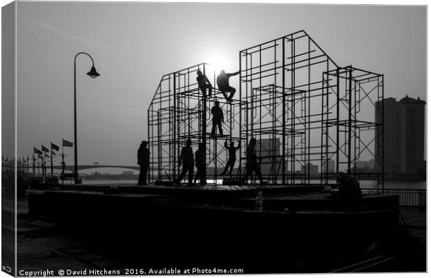 Black and white Scaffolding erectors Canvas Print by David Hitchens