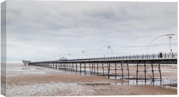 Southport Pier at low tide Canvas Print by Jason Wells
