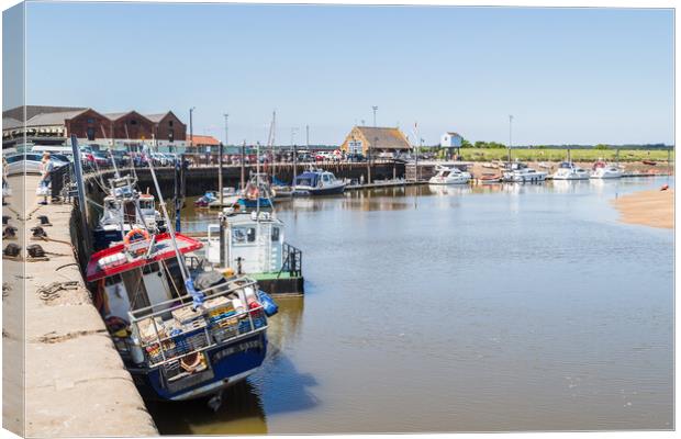 Fishing boats line the quay at Wells next the Sea Canvas Print by Jason Wells