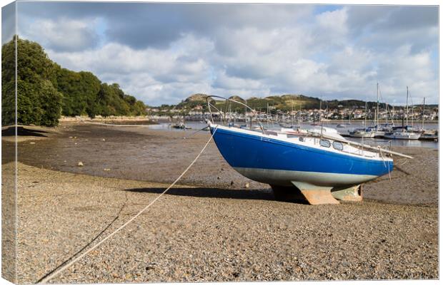 Boat beached at low tide Canvas Print by Jason Wells