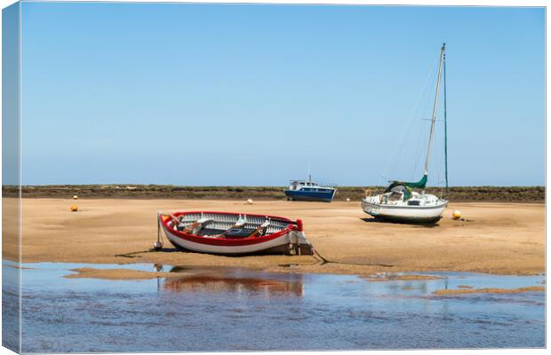 Fishing boats beached at Wells next the Sea Canvas Print by Jason Wells