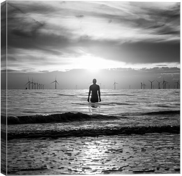 Silhouette of an Iron Man at sunset Canvas Print by Jason Wells