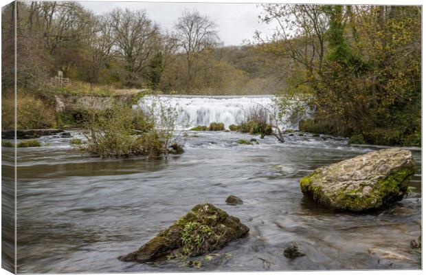 Water flowing over the Monsal Head weir Canvas Print by Jason Wells