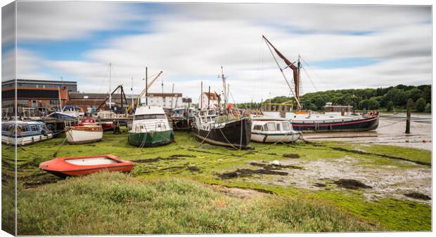 Boats line Woodbridge Quay Canvas Print by Jason Wells