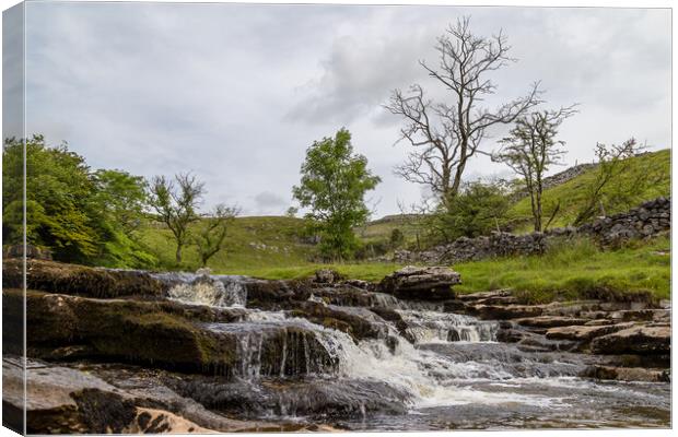 Water crashing over Raven Ray Canvas Print by Jason Wells