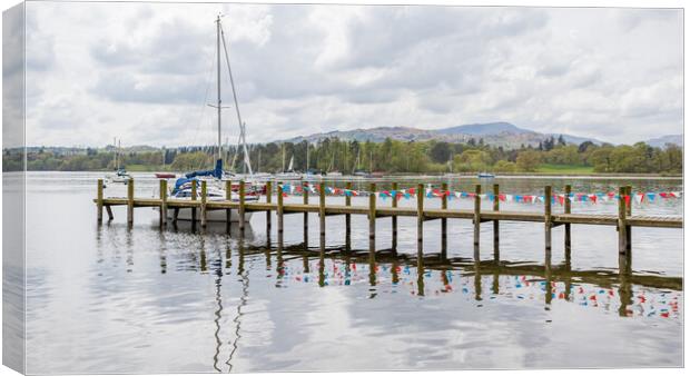 Red and white bunting reflects in Lake Windermere Canvas Print by Jason Wells