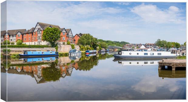 Panorama of colourful narrow boats reflecting on t Canvas Print by Jason Wells
