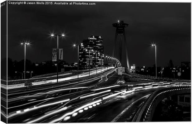  Traffic trails over the UFO Bridge at night Canvas Print by Jason Wells