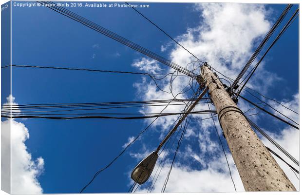 Looking up at a chaotic telegraph pole Canvas Print by Jason Wells