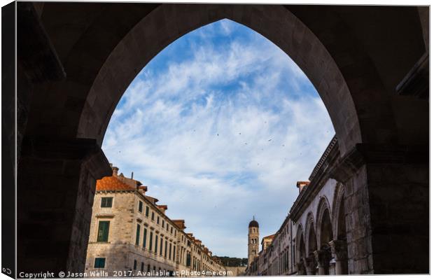 The Stradun through an archway Canvas Print by Jason Wells